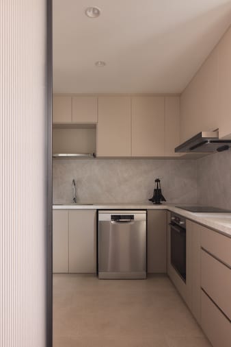 12 Keppel Bay condo kitchen featuring luxe interior design, modern cabinetry, elegant finishes, and a functional layout.