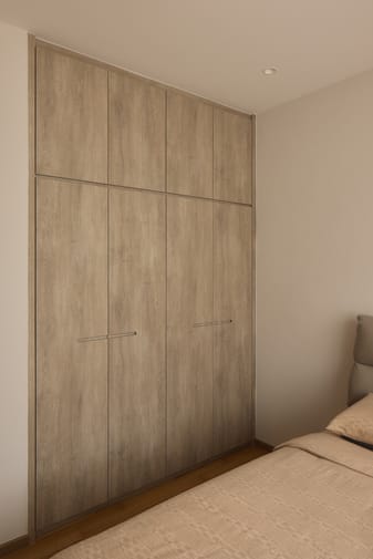 12 Keppel Bay condo bedroom featuring luxe interior design, an elegant accent wall, and a comfortable modern interior.